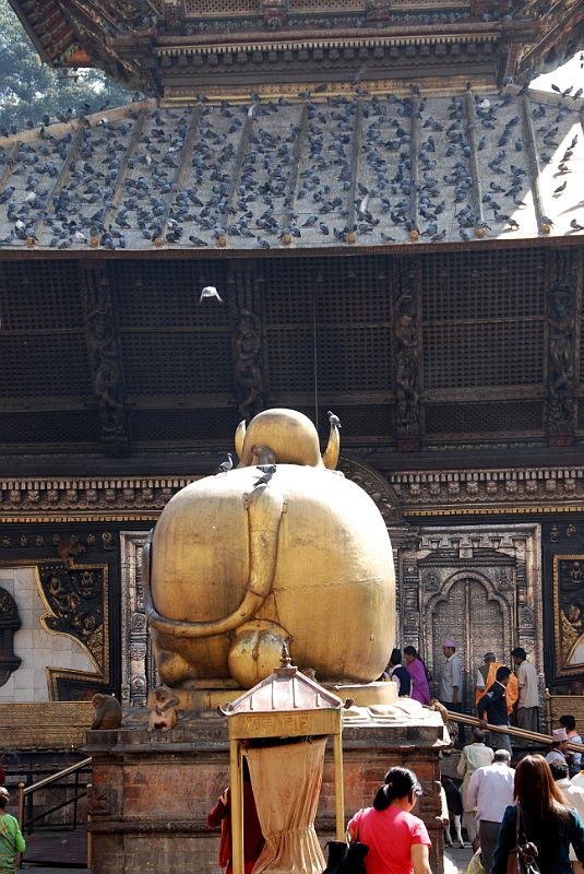 Kathmandu Pashupatinath 03 Pashupatinath Temple Entrance Nandi Bull Backside The golden rear end of Nandi, Shiva's bull, can be glimpsed in the courtyard through the western Pashupatinath entrance gate. The bull is about 300 years old.